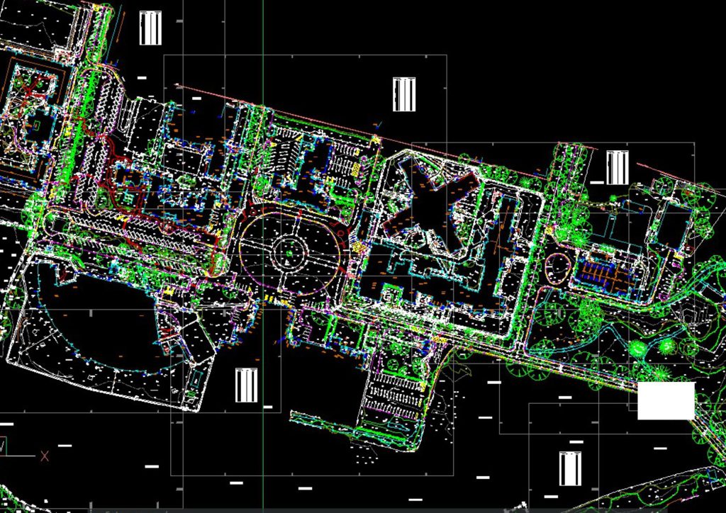 large scale topographical survey CAD drawing showing roads roundabout buildings parking and landscaping for commercial development planning scaled 1